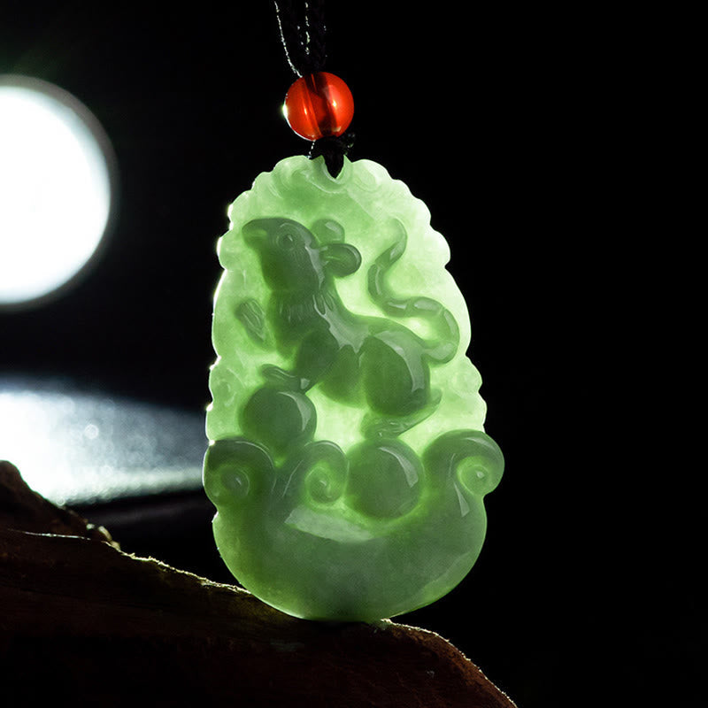 Green Jade Zodiac Necklace - Backlit rat jade showing translucency and grain, artisan crafted