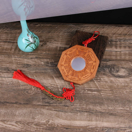 Peach Wood Bagua Map - single bagua mirror with red knot tassel and coins on rustic wood, Chinese decor