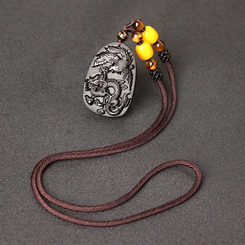 Black Obsidian Tiger Eye Dragon Phoenix Necklace – obsidian pendant with amber clusters on braided cord, spiritual