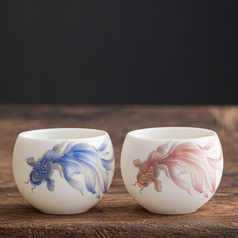 Koi Fish Porcelain Teacup - cup in tea draining tray after pouring, Kung Fu tea ritual