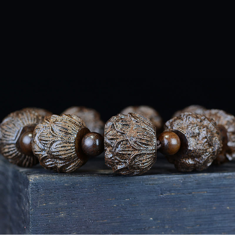 Ebony Wood Eighteen Arhats Lotus Dragon Bracelet - Macro lotus bead close-up on dark wood, Handcrafted Detail