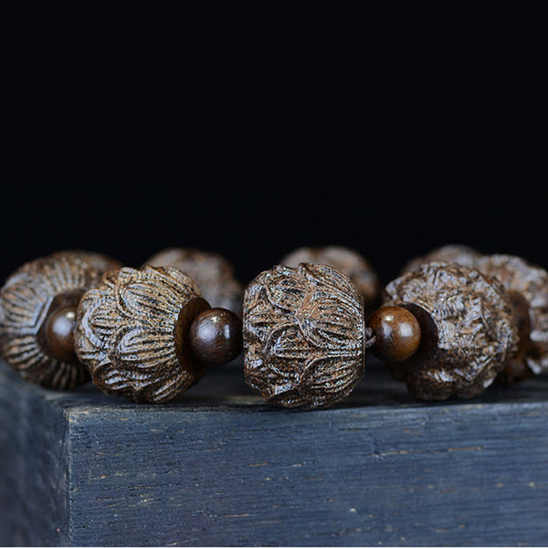 Ebony Wood Eighteen Arhats Lotus Dragon Bracelet - Macro lotus bead close-up on dark wood, Handcrafted Detail