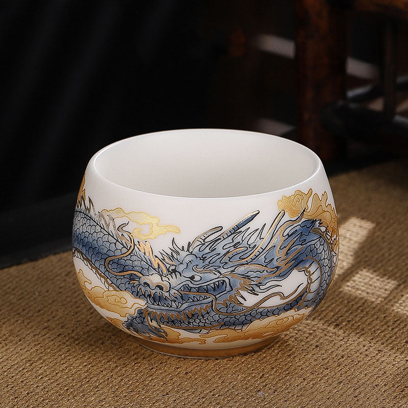 Dragon Cicada Ceramic Tea Bowl - cobalt blue and gold dragon on jade white porcelain with raised relief detail
