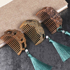 Collection of green sandalwood carved combs including fox, lotus and auspicious cloud designs