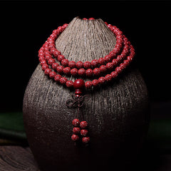 108 Mala Beads Cinnabar Bracelet – Draped on ceramic vase, red prayer beads necklace
