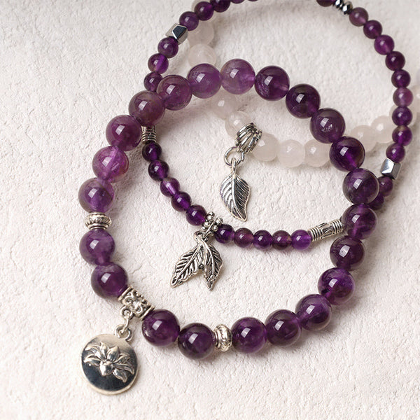 Lotus Bracelet Set – purple amethyst beads with rose quartz accent and silver feather charms, gemstone bracelet