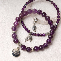 Lotus Bracelet Set – purple amethyst beads with rose quartz accent and silver feather charms, gemstone bracelet