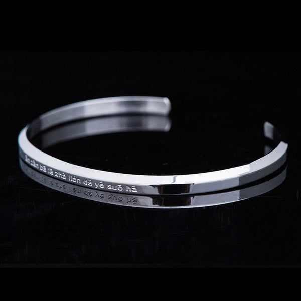 Om Mani Padme Hum Engraved Bracelet – silver cuff at low angle with Buddhist mantra, steel bangle