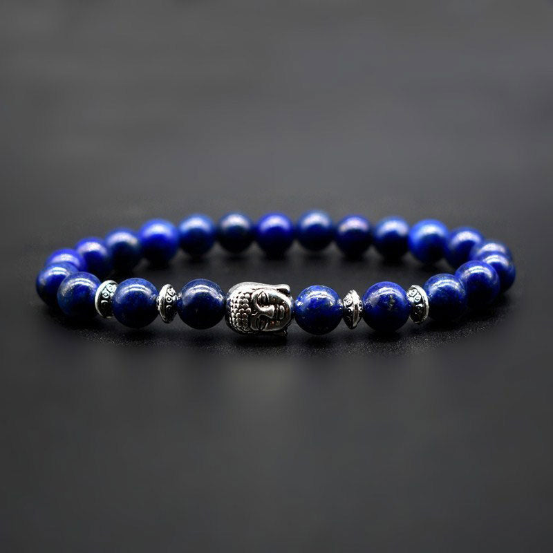 Amethyst Buddha Bracelet – Studio dark background shot of blue lapis beads with Buddha, focus jewelry