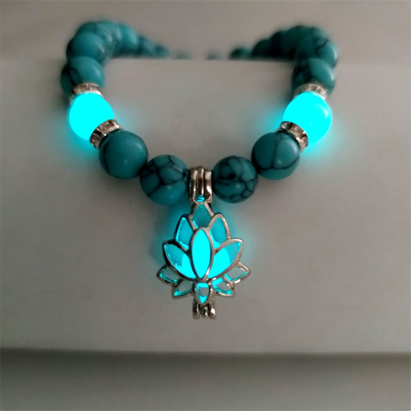 Tibetan Turquoise Glowstone Lotus Bracelet – turquoise beads with cyan glowing lotus pendant flat lay, turquoise lotus glow