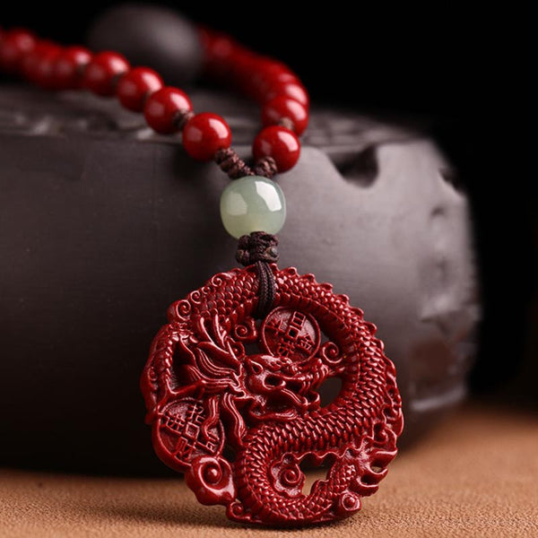 Cinnabar Hetian Jade Dragon Necklace - cinnabar dragon pendant close-up with jade bead accent