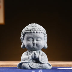 Meditation Praying Buddha Statue – natural sandstone grain and sediment layers visible, raw texture