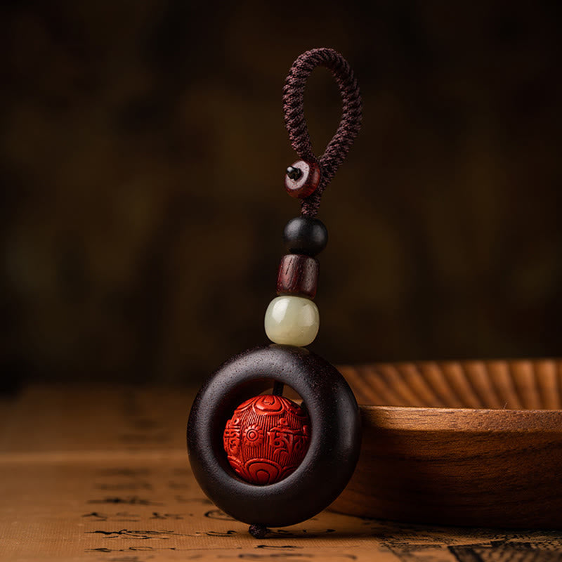 Tibetan Om Mani Padme Hum Sandalwood Cinnabar Protection Keychain – mantra bead upright by wooden bowl, Tibetan keychain