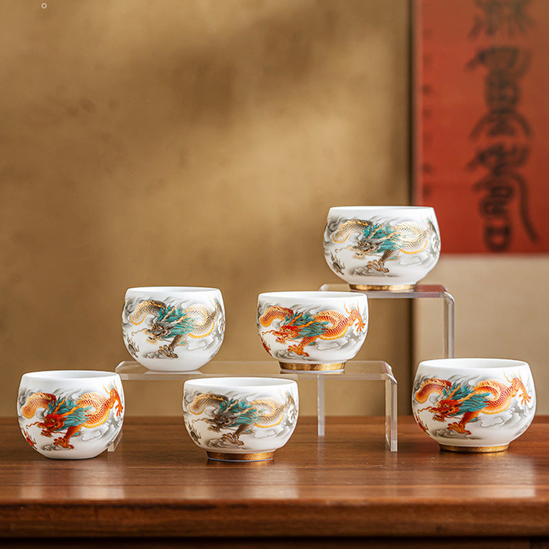 Dragon Phoenix Clouds Ceramic Teacup Gift Set – Six cups tiered display, gold and red dragon variants on warm wood table