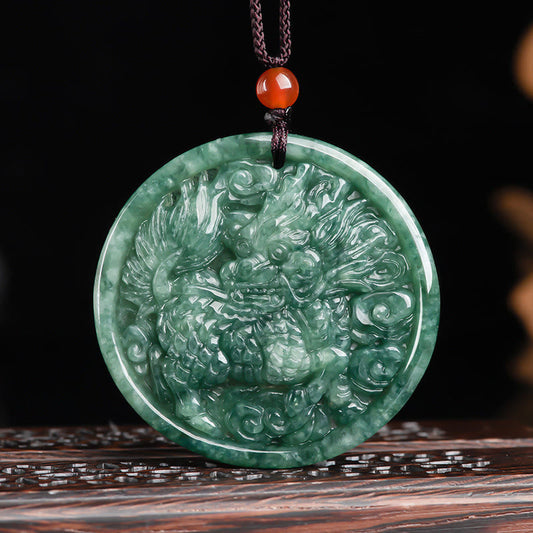 Jade Dragon Pendant – Green jadeite dragon relief carving with flame mane on dark wood stand, wealth necklace
