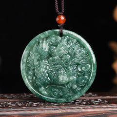 Jade Dragon Pendant – Green jadeite dragon relief carving with flame mane on dark wood stand, wealth necklace