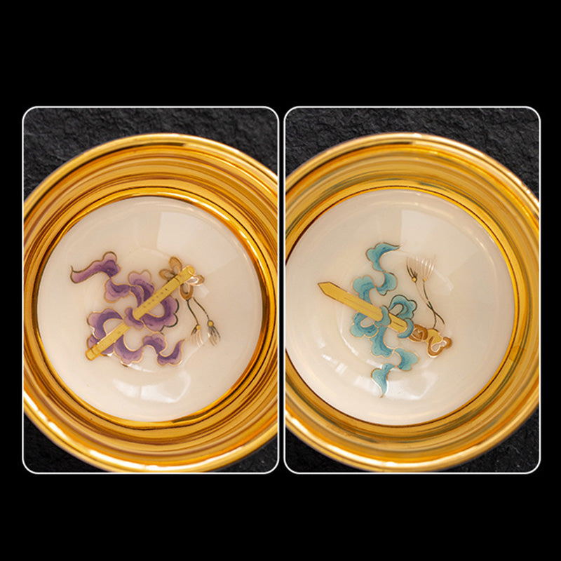 Golden Eagle Dragon Gilt Ceramic Teacup – pair of gold-rimmed decorative medallions with enamel sword and ribbon motifs, ornamental