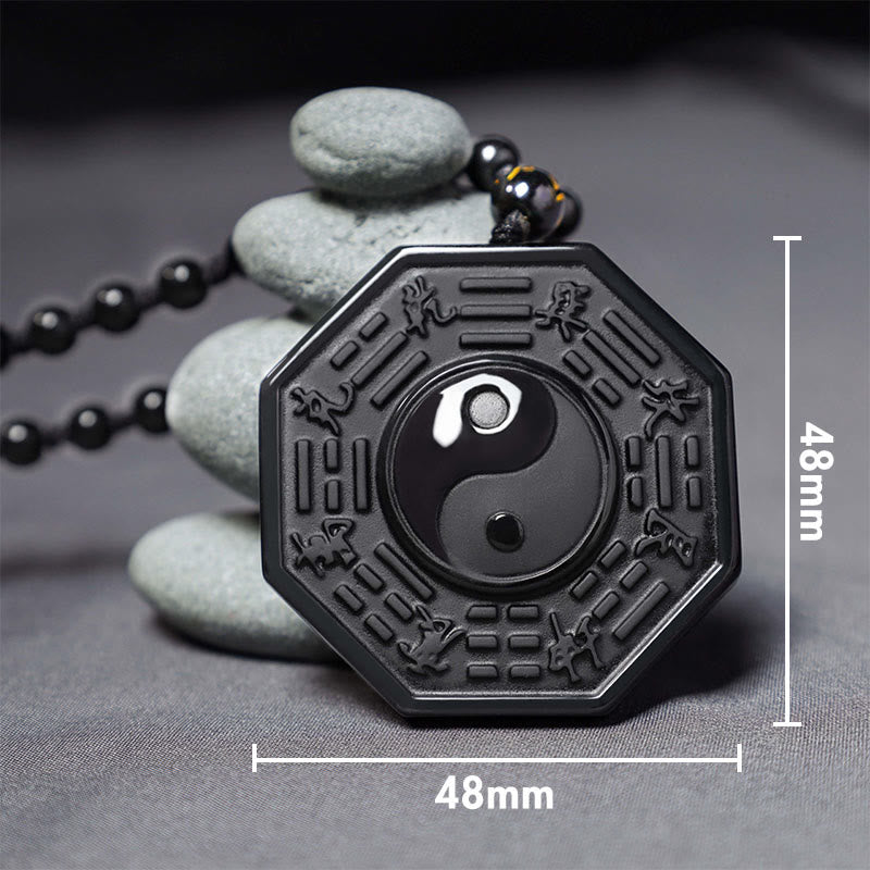 Black Obsidian Yin Yang Pendant Necklace - bagua pendant with zen stone stack, obsidian yin-yang amulet detail shot