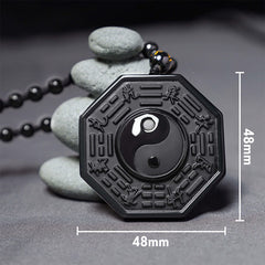 Black Obsidian Yin Yang Pendant Necklace - bagua pendant with zen stone stack, obsidian yin-yang amulet detail shot