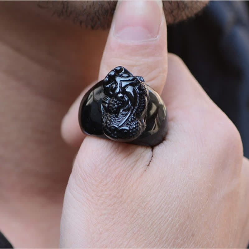FengShui PiXiu Strength Ring – Obsidian pixiu ring worn on finger close-up, power protection ring
