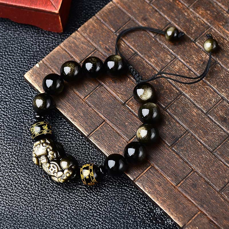 Gold Sheen Obsidian Pixiu Bracelet – On carved wood board with leather, adjustable cord detail, healing