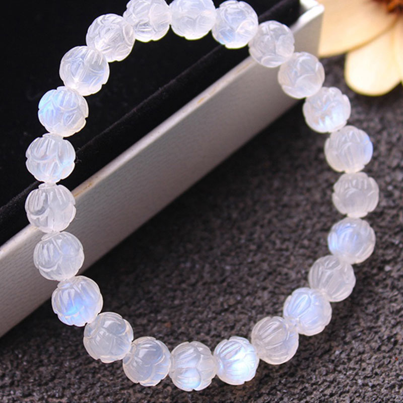 Natural Moonstone Lotus Love Bracelet - circular layout in velvet tray, blue adularescence