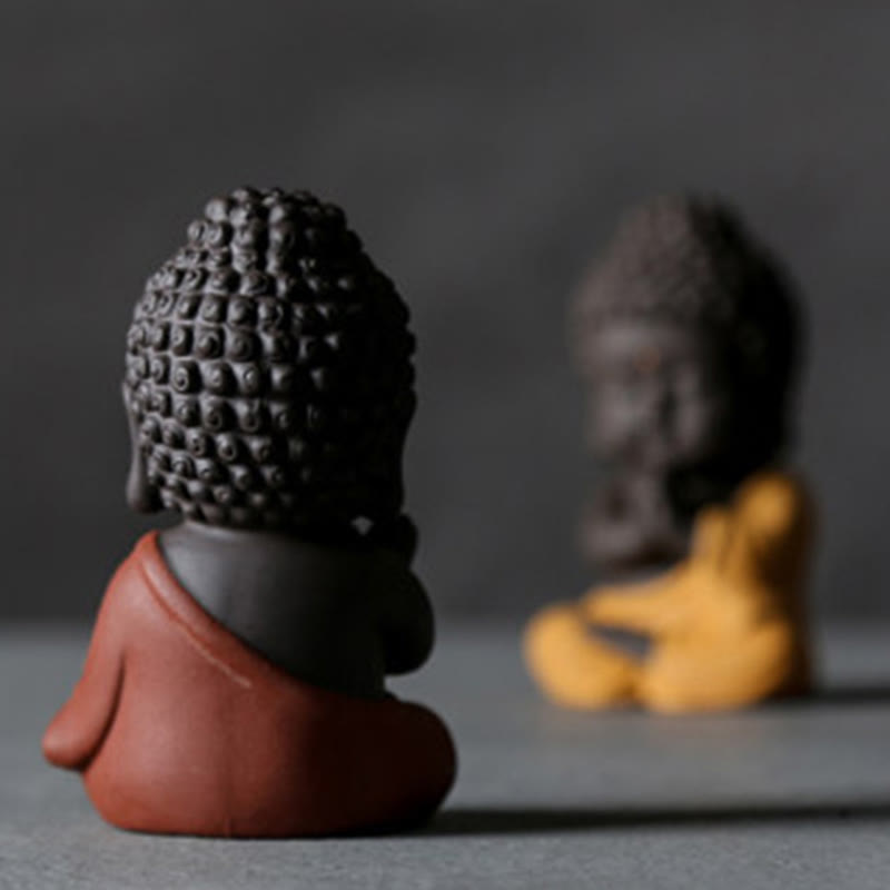 Small Buddha Purple Clay Decoration – two-tone dark and red clay figures, rear three-quarter depth shot, artisan texture