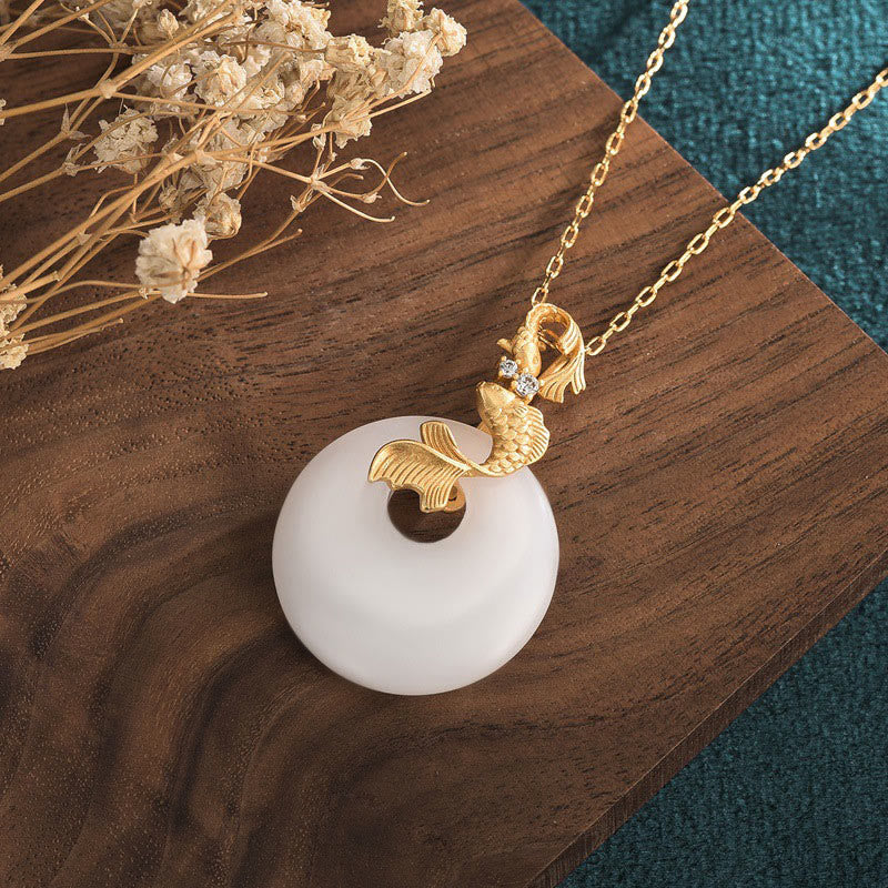 White Jade Koi Necklace – Jade koi pendant necklace worn showing copper chain, Feng Shui piece