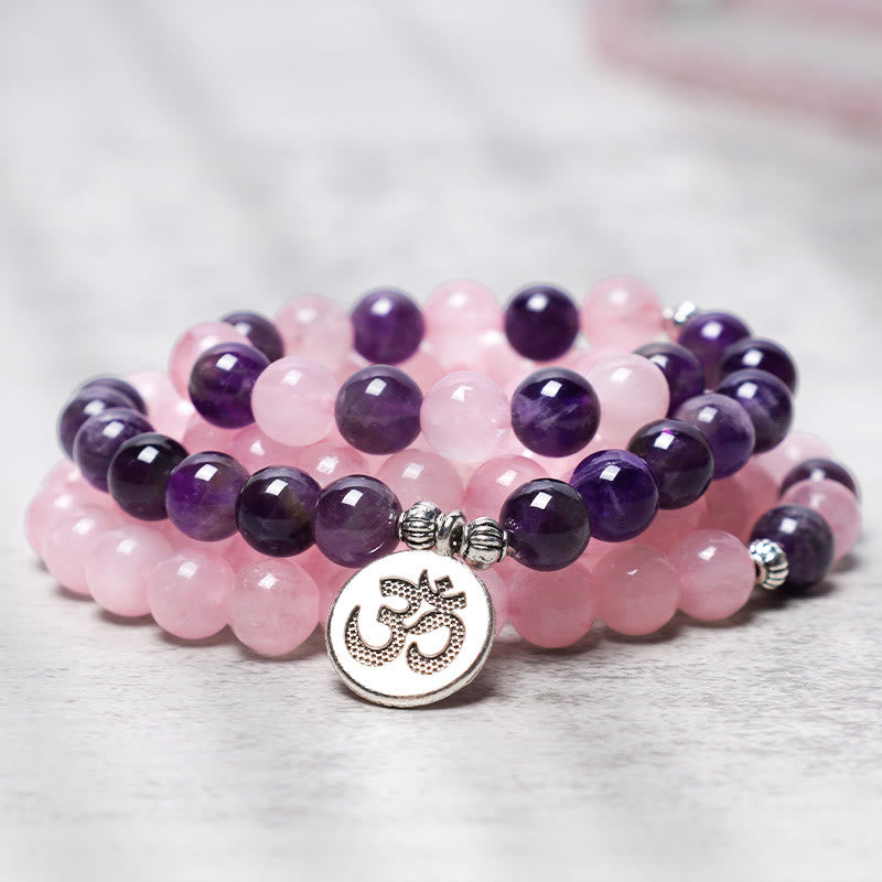 Rose Quartz Amethyst Mala Bracelet – closeup with silver OM symbol charm, front closeup