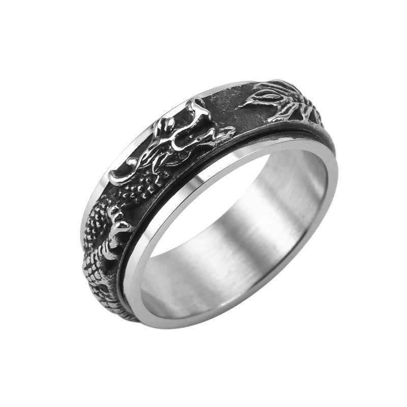 Dragon Titanium Steel Ring – Silver-gold dragon spinner on dark slate, balanced