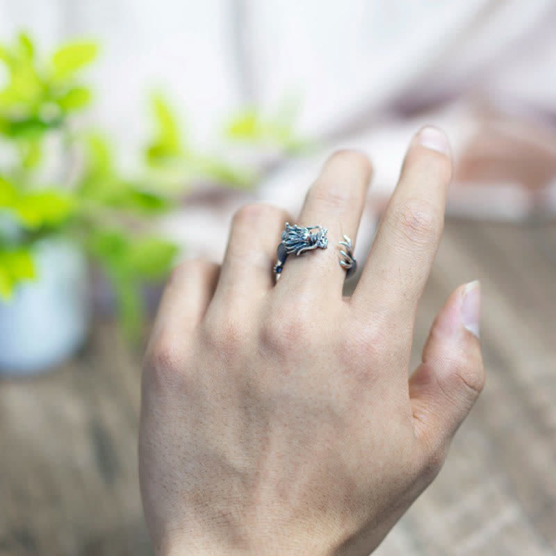 925 Sterling Silver Dragon Ring – Ring on hand against blurred green plant and indoor background, Wearable