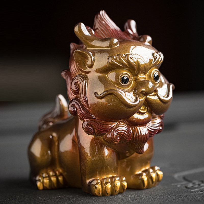 Small PiXiu Tea Pet – Front close-up of golden PiXiu on dark tea tray, glossy resin finish