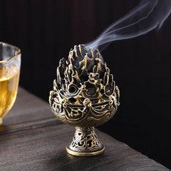 Copper Mountain Incense Burner – Low angle on dark wood with teacup, smoke rising from openwork peaks, tea ceremony decor