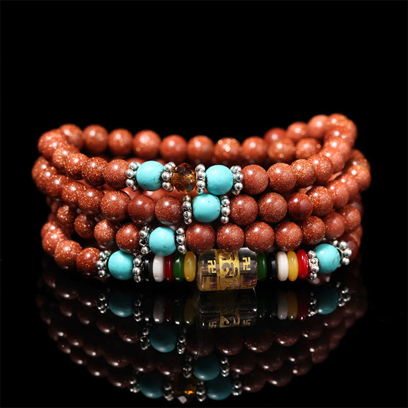 Goldstone Mala Bracelet – coiled multi-strand goldstone beads with turquoise on black, prayer jewelry