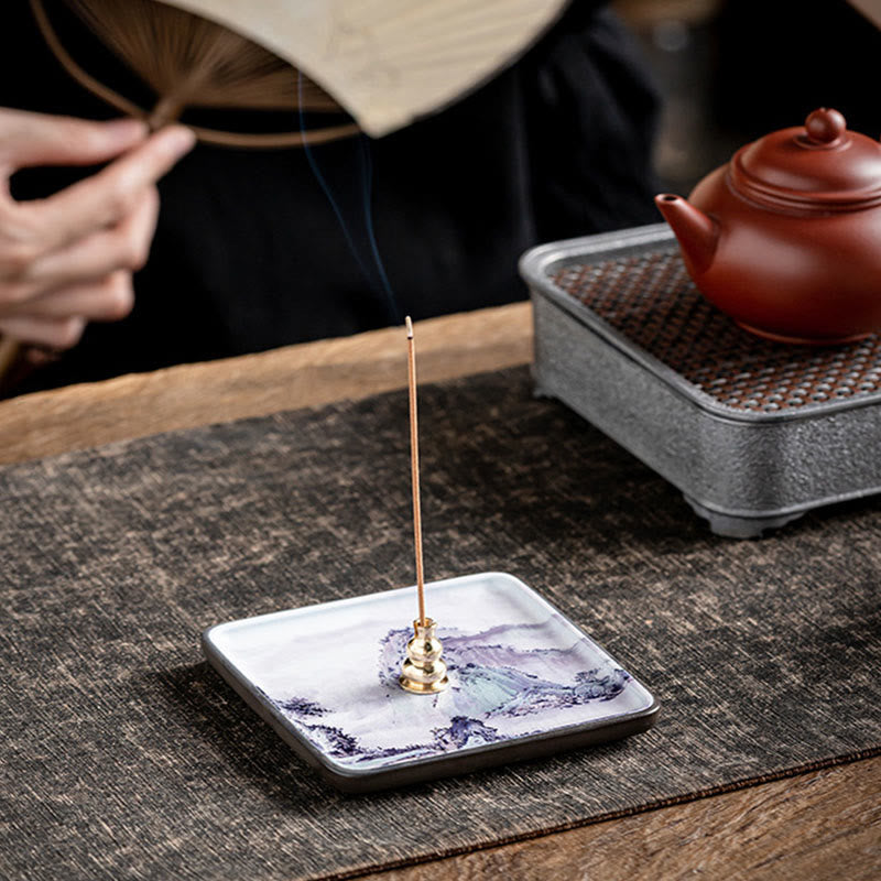 Mountain Lake Incense Burner – Purple mountain landscape ceramic plate with brass holder in tea ceremony setting