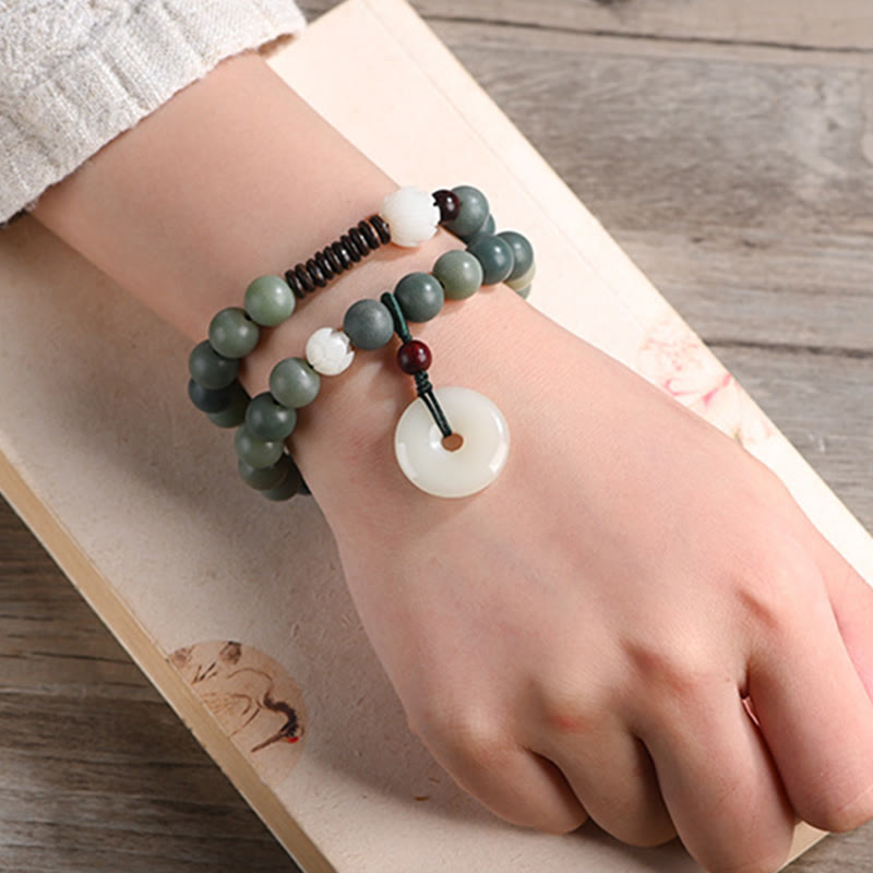 Cyan Bodhi Seed Jade Peace Buckle Bracelet - sage green wrist mala on calligraphy paper, cultural aesthetic