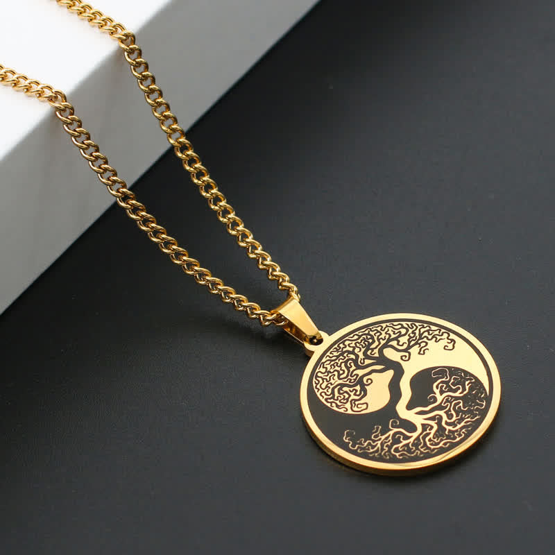 Tree of Life Titanium Steel Necklace – gold pendant on dark surface with white block, angled view, connection pendant