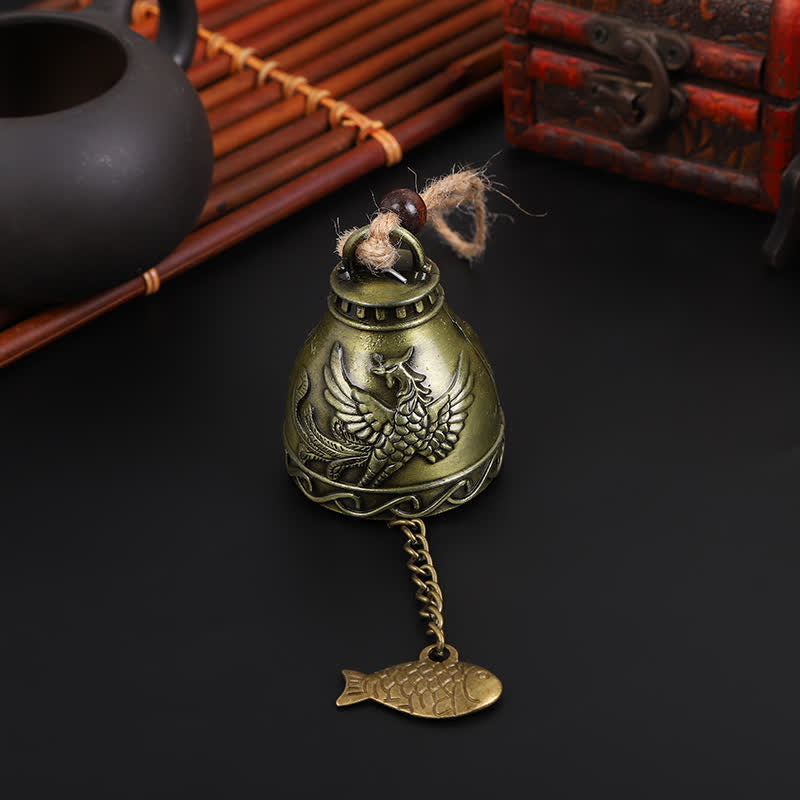 Feng Shui Wind Chime Bell - Phoenix relief on antique bronze bell with dark moody setting, rebirth decor