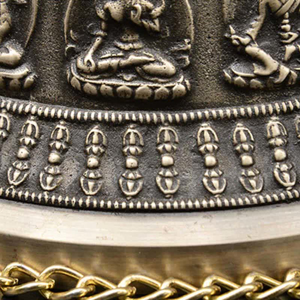 Tibetan Buddha Dragon Bell macro detail of vajra motif band and lotus throne deities, ritual, ornate
