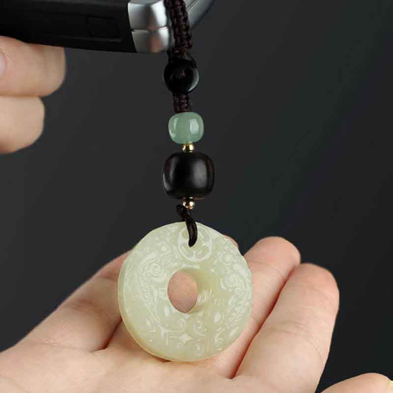 Jade PiXiu Peace Buckle Abundance Key Chain – Jade peace buckle on dark wood with rustic wood background, zen decor
