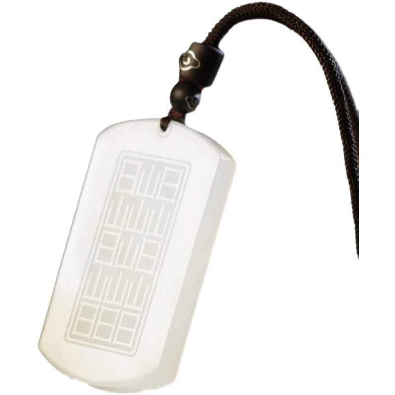 White Jade PiXiu Pendant – Back of white jade pendant with bagua trigrams isolated on white background