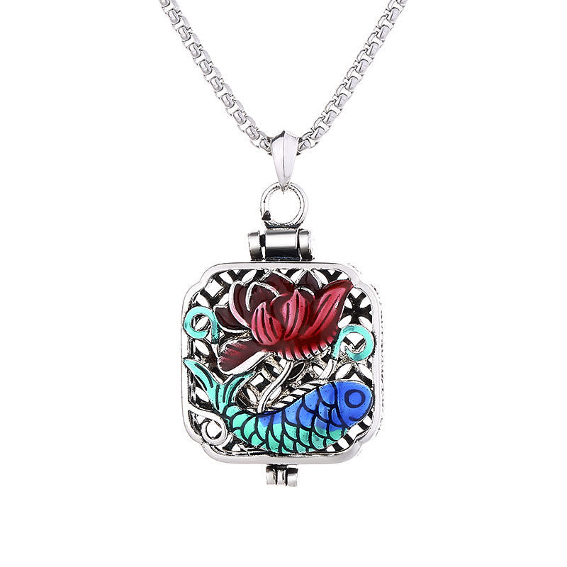 Koi Fish Lotus Ghau Prayer Box Necklace – burgundy lotus and blue koi on white background, straight-on product shot