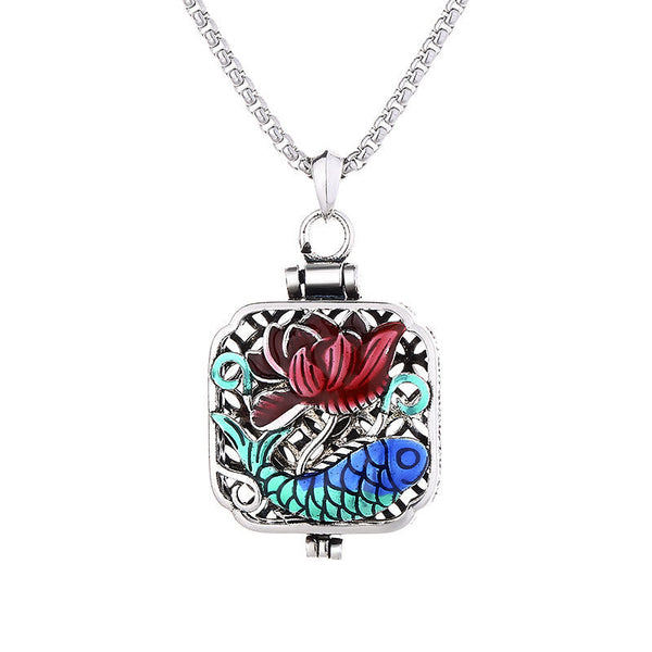 Koi Fish Lotus Ghau Prayer Box Necklace – burgundy lotus and blue koi on white background, straight-on product shot