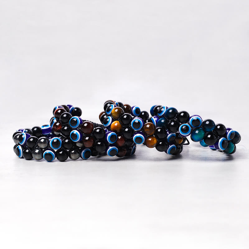 Evil Eye Hematite Tiger Eye Bracelet – five stacked bracelets showing black tiger eye and evil eye bead variations