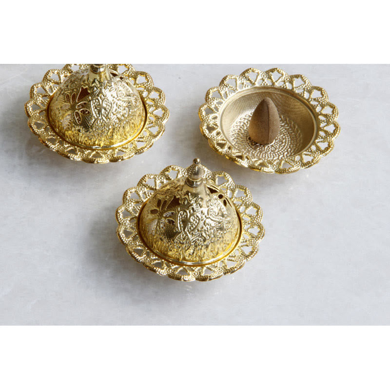 Tibetan Gold Mini Meditation Incense Burner – Hand lifting gold dome lid revealing incense cone inside, assembled view