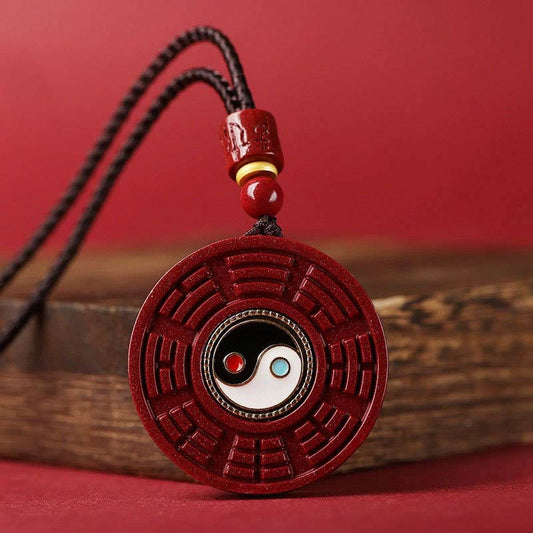 Cinnabar Bagua Rotatable Yin Yang Necklace – Red cinnabar Bagua pendant with Yin-Yang center on wood, Taoist amulet