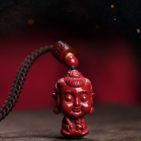 Chinese Zodiac Cinnabar Pendant – Red Buddha figure against crimson studio backdrop, meditation necklace