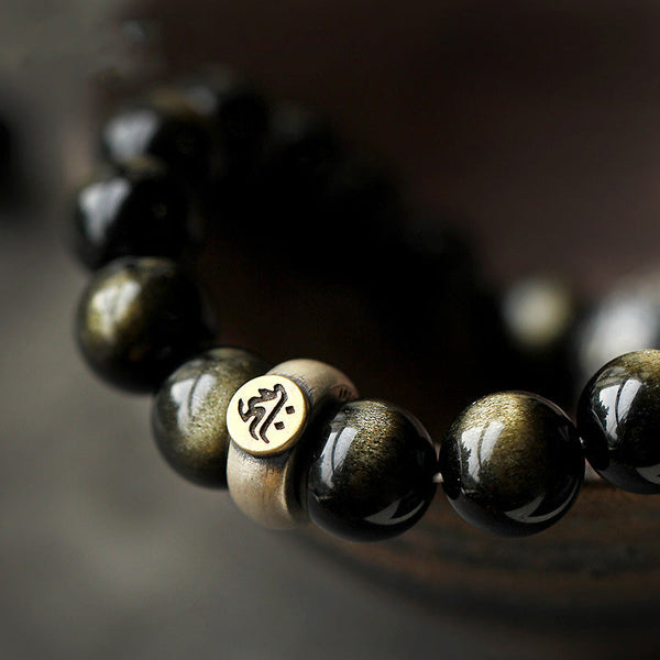 Zodiac Natal Buddha Obsidian Silver Bracelet - Curved view with bone accent bead and gold inlaid disc