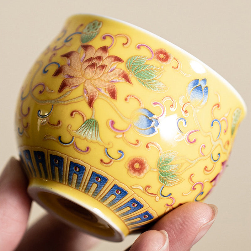 Lotus Pod Ceramic Tea Cup – low angle close-up of yellow lotus enamel, ceramic tea cup