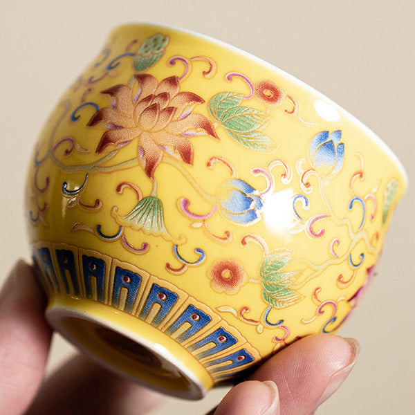 Lotus Pod Ceramic Tea Cup – low angle close-up of yellow lotus enamel, ceramic tea cup